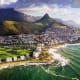 Aerial view of Cape Town's coastline with Table Mountain, Signal Hill, and the Twelve Apostles mountain range overlooking the